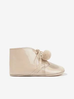 Andanines Baby Pom Pom Lace Up Booties in Beige