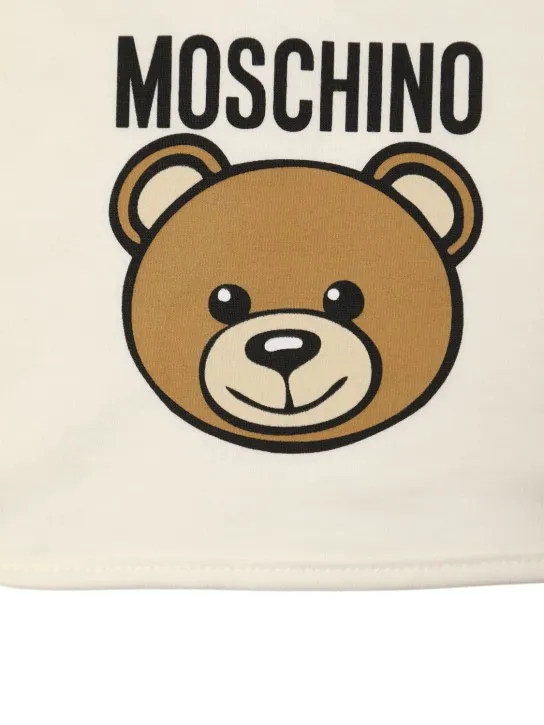 Moschino   Printed cotton romper, bib &amp; hat 