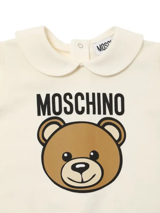 Moschino   Printed cotton romper, bib &amp; hat 